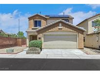 Two-story home featuring a two car garage, neutral color palette and solar panels at 6678 Crystal Run Ln, Las Vegas, NV 89122