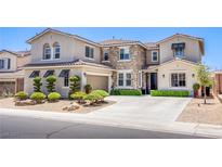 Beautiful two-story home with a stone facade and manicured front yard at 7445 Mezzanine View Ave, Las Vegas, NV 89178