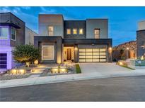 Modern two-story home featuring a stylish garage door, landscaped yard, and contemporary design at 746 Horizon Canyon Dr, Henderson, NV 89052