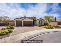 Charming single-story home featuring a three-car garage and a well-maintained brick driveway at 10470 Irish Cliffs Ct, Las Vegas, NV 89149