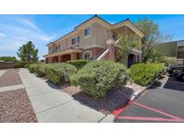Attractive two-story condo with lush landscaping, covered parking, and a bright, open design at 10553 Pine Glen Ave # 101, Las Vegas, NV 89144