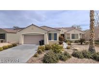Charming single-story home with a well-manicured front yard and a two-car garage at 1652 Black Fox Canyon Rd, Henderson, NV 89052