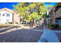 Condominium exterior showcasing walkways and meticulously maintained landscaping at 2101 Sealion Dr # 108, Las Vegas, NV 89128