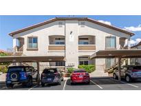 Multi-Gathering home with tan siding and covered parking, offering convenient and stylish living at 2305 W Horizon Ridge Pkwy # 524, Henderson, NV 89052