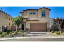 Two-story home featuring stucco siding, a brown tiled roof, and a two-car garage in a residential neighborhood at 3002 Coveri Ct, Las Vegas, NV 89141