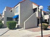 A charming condominium featuring well-maintained landscaping and a welcoming facade at 4230 Gannet Cir # 216, Las Vegas, NV 89103