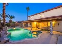 Backyard pool and hot tub with covered patio, perfect for outdoor entertaining in a great residential neighborhood at 4539 Peardale Dr, Las Vegas, NV 89147