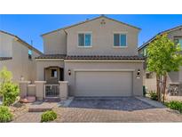 Charming two-story home featuring a two-car garage and a well-maintained front yard at 6313 Voss St, North Las Vegas, NV 89081