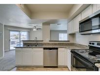 Modern kitchen with stainless steel appliances and granite countertops at 6800 E Lake Mead Blvd # 2072, Las Vegas, NV 89156
