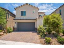 Charming two-story home with a two car garage and beautifully landscaped front yard with desert landscaping at 7124 Sayonara Vista St, North Las Vegas, NV 89084