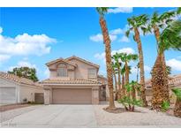 Charming two-story home featuring a tile roof, desert landscaping, and an attached two-car garage at 8379 Drop Camp St, Las Vegas, NV 89123