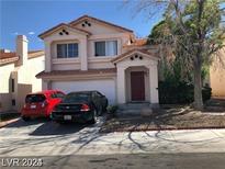 Two-story home featuring desert landscaping, attached two-car garage, and neutral color palette at 8769 Country View Ave, Las Vegas, NV 89129