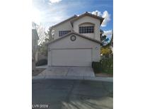 Two-story home featuring an attached two-car garage and neutral stucco exterior at 9617 Pine River Ln, Las Vegas, NV 89123