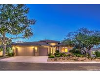 Beautiful single-story home with mature landscaping, a three-car garage, and a neutral stucco exterior at 10300 Wellside Hill Ave, Las Vegas, NV 89145