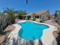 Beautiful backyard pool with clear blue water and patio space, perfect for relaxation and outdoor enjoyment at 13 Desert Dawn Ln, Henderson, NV 89074