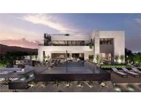 Stunning backyard with infinity pool, bar, lounge area, and spiral staircase in a modern home at 1516 Pleasant Bay Ct, Henderson, NV 89011