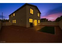 Two-story home with outdoor patio space and low maintenance landscaping at 5232 Mountain Garland Ln, North Las Vegas, NV 89081
