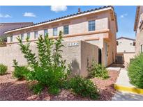 Charming townhouse featuring a stucco facade, well-maintained landscaping, and clear unit number at 9572 Belle Rich St, Las Vegas, NV 89123