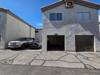Multi-Gathering home features private garages, ample parking and a neutral color palette at 1739 N Lamont St, Las Vegas, NV 89115