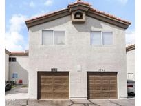 Charming two-story townhome featuring private garages and desert landscaping at 1739 N Lamont St, Las Vegas, NV 89115
