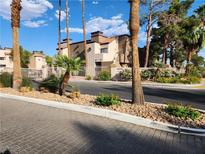 Charming condo with well-maintained desert landscaping and a secure gated entrance at 2986 Juniper Hills Blvd # 202, Las Vegas, NV 89142