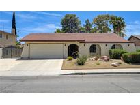 Charming single-story home featuring stucco siding, desert landscaping and an attached two-car garage at 3063 Chapala Dr, Las Vegas, NV 89120
