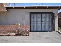 Secured garage with metal gate and block wall, offering both security and curb appeal at 3260 N Heritage Way, Las Vegas, NV 89121