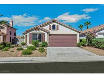 Charming single-story home showcasing a well-manicured front yard and a two-car garage at 6035 Shadow Oak Dr, North Las Vegas, NV 89031