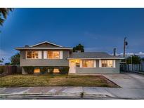 Charming two-story home featuring a well-maintained front yard and inviting curb appeal at 6213 Fairwood Ave, Las Vegas, NV 89107
