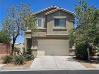 Two-story home with desert landscaping, a two car garage and a well-maintained, neutral colored exterior at 6824 Briarwood Bend Ave, Las Vegas, NV 89130