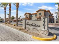 Beautiful community entrance with palm trees and desert landscaping, La Paloma at 7701 at 7701 W Robindale Rd # 274, Las Vegas, NV 89113