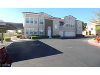 Modern condo with two-car garage, carport, and manicured landscaping in a desirable community at 9975 Peace Way # 1149, Las Vegas, NV 89147