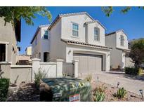 Charming two-story home with a two-car garage and a well-maintained, xeriscaped front yard at , Henderson, NV 89011