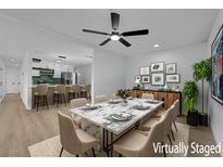 Elegant dining room featuring a marble table and stylish decor, connecting to a modern kitchen at 1108 Putnam Ave, North Las Vegas, NV 89030