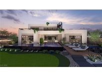 Modern two-story home with a pool, putting green, and lounge area, perfect for outdoor relaxation at 1508 Pleasant Bay Ct, Henderson, NV 89011