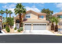 Charming two-story home with well-maintained landscaping and a two-car garage in a sunny neighborhood at 179 Adomeit Dr, Henderson, NV 89074