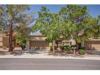 Charming single-story home with a two-car garage and mature trees in a well-maintained community at 2541 Desert Glen Dr, Las Vegas, NV 89134