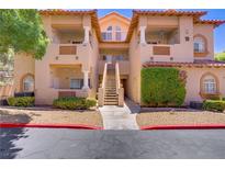 Attractive condo building featuring a well-maintained exterior, balconies, and landscaped grounds at 2925 Wigwam Pkwy # 1021, Henderson, NV 89074