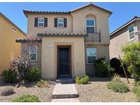 Charming two-story home featuring well-kept landscaping and a welcoming front entrance at 3165 Beltrada Ave, Henderson, NV 89044