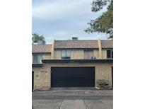Two-story townhome featuring a private garage and stucco exterior at 3226 Weber Ct, Las Vegas, NV 89121
