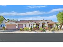 Charming single-story home featuring a tile roof, desert landscaping, and an attached two-car garage at 328 Hedgehope Dr, Las Vegas, NV 89183