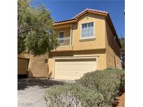 Two-story home featuring a two-car garage and a charming balcony at 3508 Harbor Tides St, Las Vegas, NV 89147