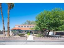 Charming exterior view featuring a red tile roof, mature trees, and inviting curb appeal at 3790 W Moberly Ave, Las Vegas, NV 89139