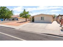 Cozy single-story home with a low-maintenance yard and a long driveway for convenient parking at 409 Antelope Way, Las Vegas, NV 89145