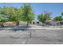 Charming single-story home with a well-maintained front yard and secure chain-link fence at 4424 Sunrise Ave, Las Vegas, NV 89110