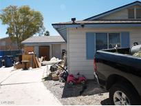 Exterior view of a single story home with a truck parked on the side at 5068 Killarney St, Las Vegas, NV 89122