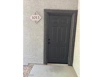 Apartment front door with visible unit number and dark gray door at 6955 N Durango Dr # 1013, Las Vegas, NV 89149