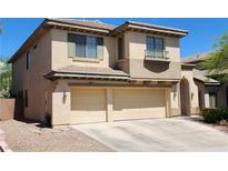 Two-story home featuring a neutral stucco exterior and a convenient three-car garage at 9052 Pine Mission Ave, Las Vegas, NV 89143