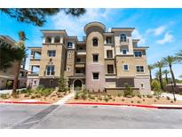 Stunning condo building with manicured landscaping, offering a luxurious and inviting curb appeal at 128 Los Cabos Dr # 302, Las Vegas, NV 89144