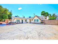 Charming single-story home featuring a spacious driveway and well-maintained landscaping, perfect for suburban living at 1700 Ivanhoe Way, Las Vegas, NV 89102